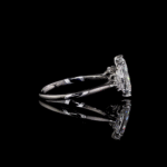 Vintage-inspired diamond engagement ring with reflective black surface