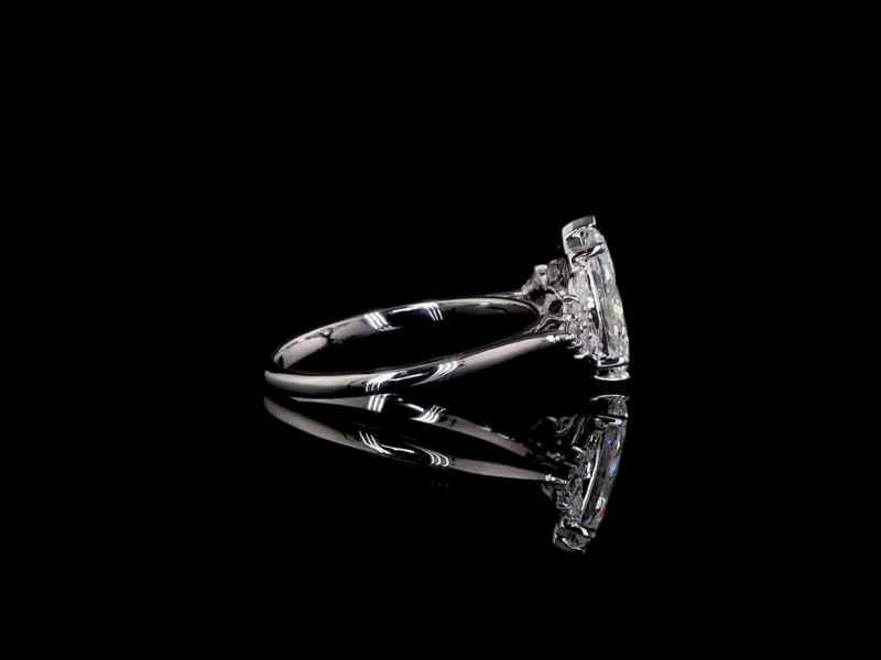 Vintage-inspired diamond engagement ring with reflective black surface