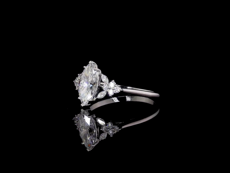 Elegant marquise-cut diamond ring with pear and round accent diamonds