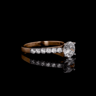 A timeless round lab-grown diamond set in a two-tone pavé band. Classic beauty meets modern elegance in this stunning engagement ring.