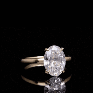 oval diamond ring, solitaire engagement ring, yellow gold engagement ring, minimalist diamond ring, vevajewel ring, elegant proposal ring, modern solitaire ring, timeless engagement ring, oval cut diamond, classic gold ring