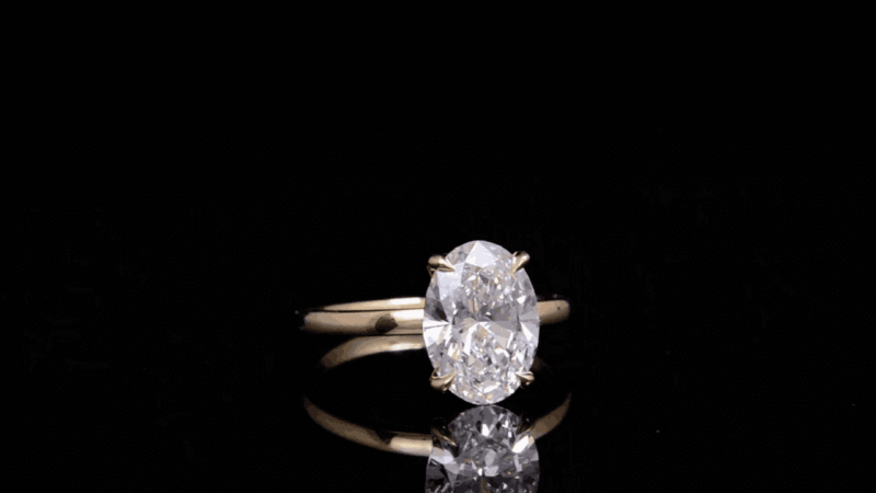 oval diamond ring, solitaire engagement ring, yellow gold engagement ring, minimalist diamond ring, vevajewel ring, elegant proposal ring, modern solitaire ring, timeless engagement ring, oval cut diamond, classic gold ring