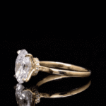 oval diamond ring, solitaire engagement ring, yellow gold engagement ring, minimalist diamond ring, vevajewel ring, elegant proposal ring, modern solitaire ring, timeless engagement ring, oval cut diamond, classic gold ring