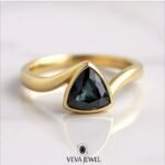 Trillion cut grey moissanite ring in yellow gold