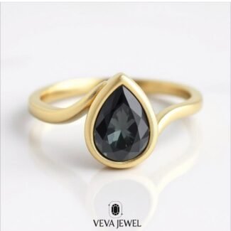 grey pear cut moissanite engagement ring in yellow gold