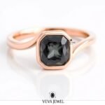Bezel set grey moissanite ring with bypass band