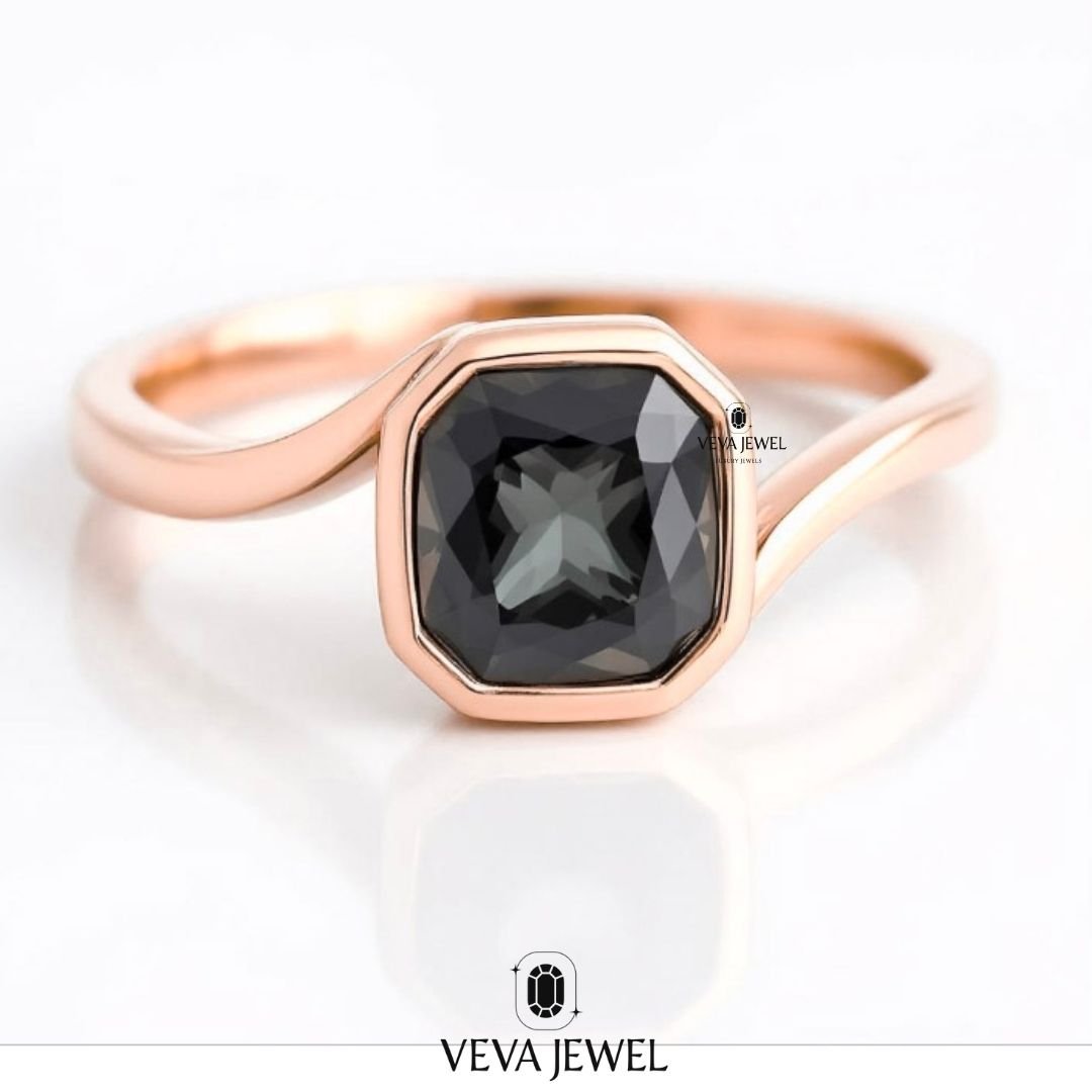 Bezel set grey moissanite ring with bypass band