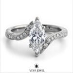 vintage inspired moissanite engagement ring with pavé band
