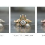 Antique style diamond ring with green accent stones