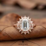 solid gold emerald cut bridal ring with geometric halo