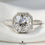 Yellow gold moissanite ring with engraved band