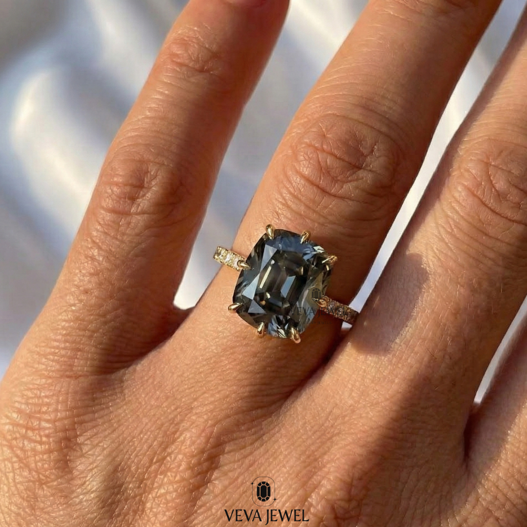 Gold engagement ring with grey moissanite center