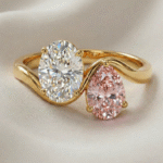 Oval cut moissanite and pink diamond two stone gold engagement ring