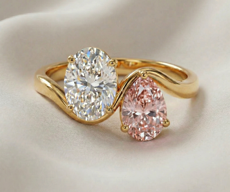 Oval cut moissanite and pink diamond two stone gold engagement ring