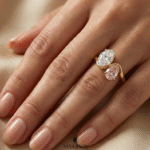 Toi et Moi style ring with oval moissanite and pink sapphire gold band