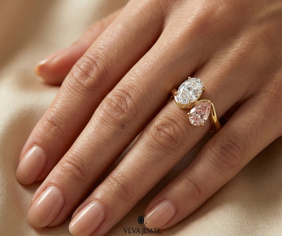 Toi et Moi style ring with oval moissanite and pink sapphire gold band