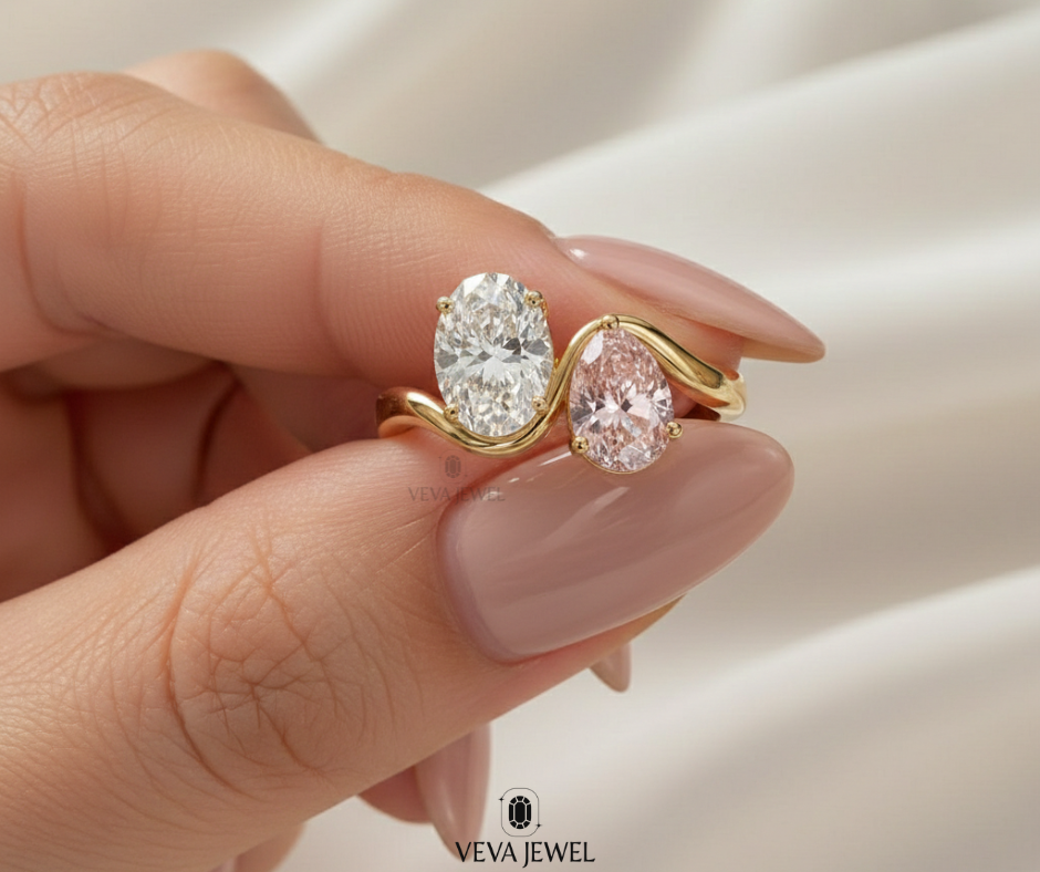 Yellow gold bypass ring with oval white and blush pink gemstones