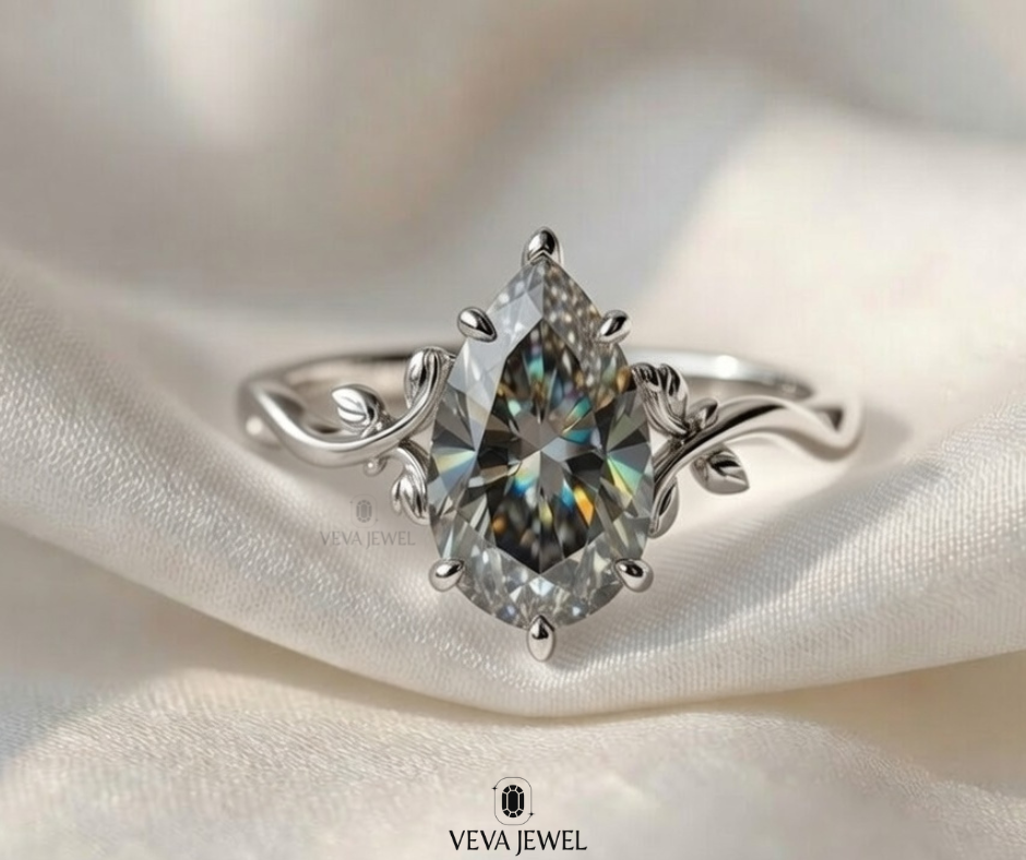 Grey moissanite ring in floral vine setting