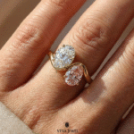 Gold crossover ring featuring oval moissanite and pink gemstone