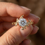 solid gold botanical engagement ring with round diamond